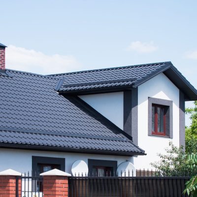 The dark-colored roof of a new residential private house